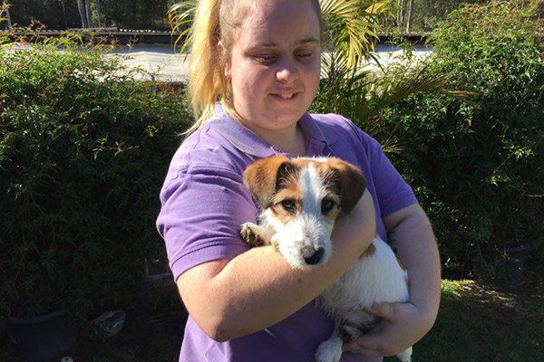 girl holding dog