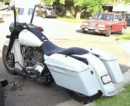 Fully Customized Harley-Davidson in white with lots of chrome finishes by XLerated Customs & Cycles