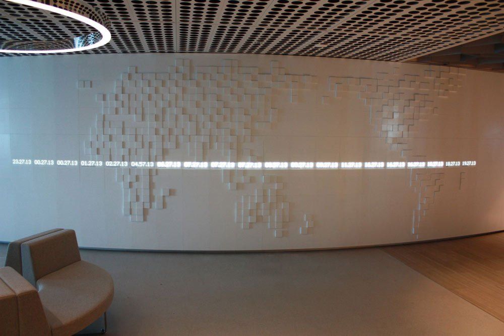 white solid surface wall with square map of world