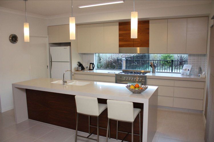 white solid surface breakfast bar with white stools