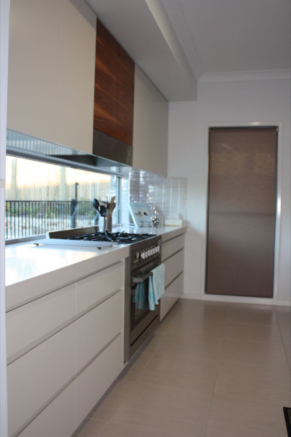 white solid surface counter tops in long kitchen