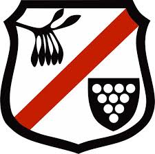 A shield with a red stripe and a bunch of grapes on it.