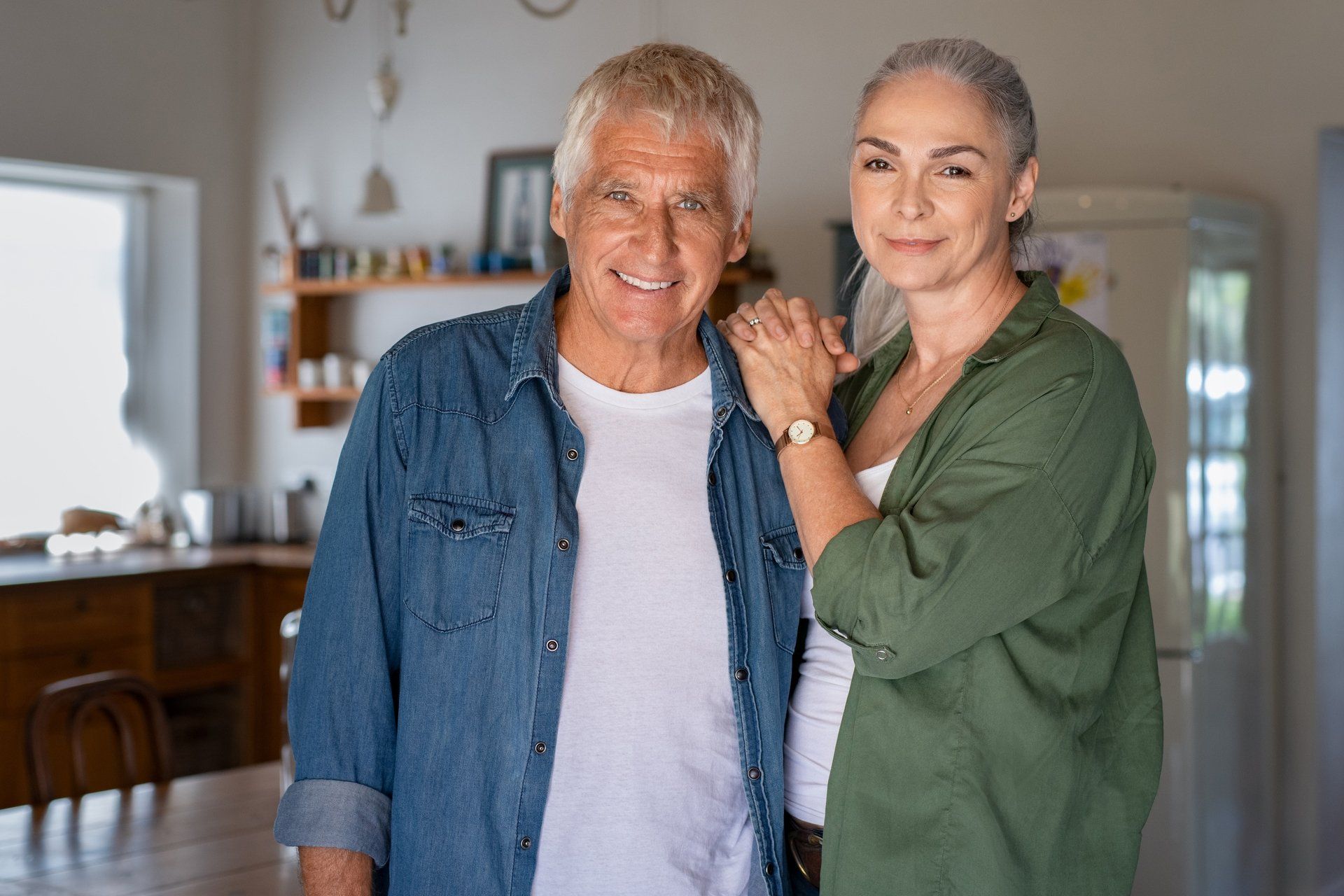 Happy senior couple at home, possibly indicating relaxed retirement lifestyle