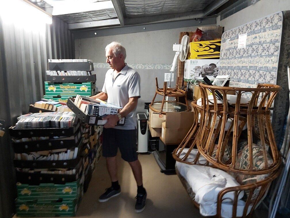 People Unloading Car in-front of Storage Shed — Self Storage in Ulladulla, NSW People Unloading Car in-front of Storage Shed — Self Storage in Ulladulla, NSW