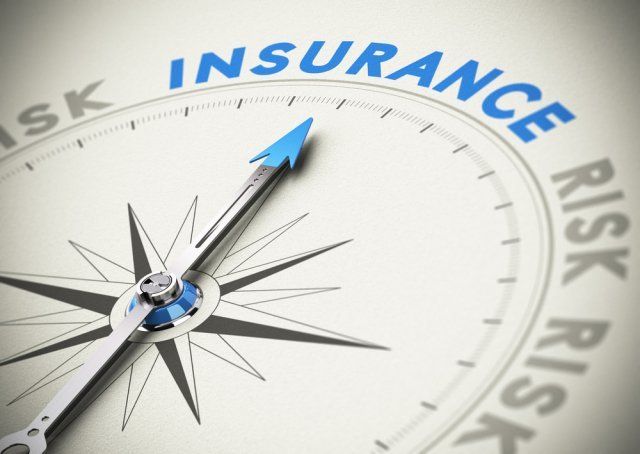 Compass with arrow pointing toward the word insurance