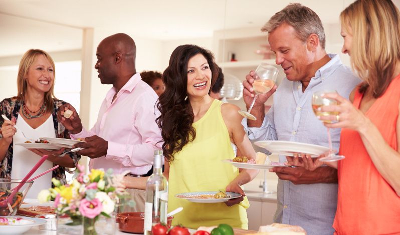 Adults at a party laughing