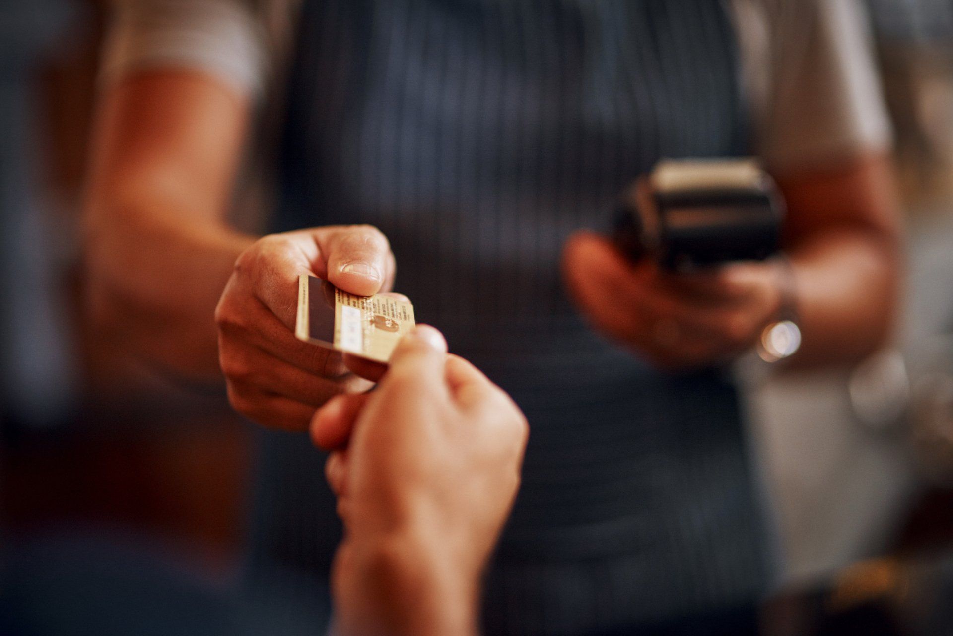 Hand with credit card in it