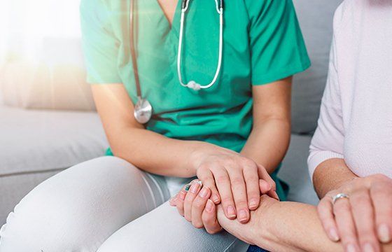 Close-up of Person Touching Hand of Senior Woman — Kenosha, WI — Home Care Services