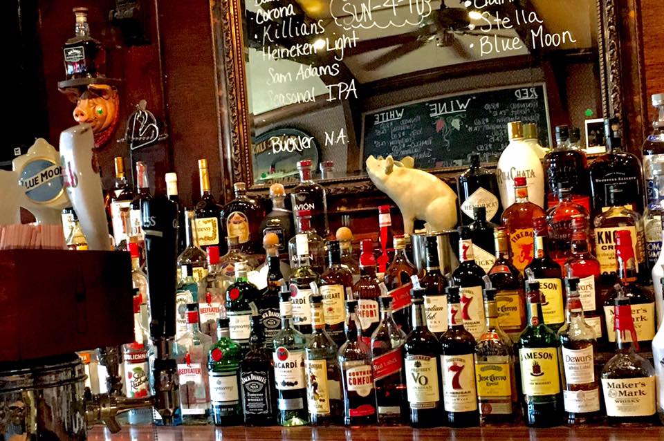 back of bar with liquor bottles showing