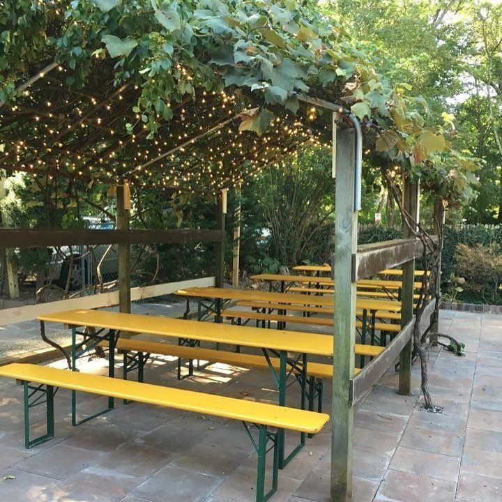 patio with lights and picnic tables