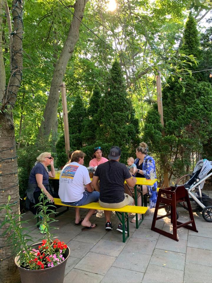 beer garden table with people sitting at it