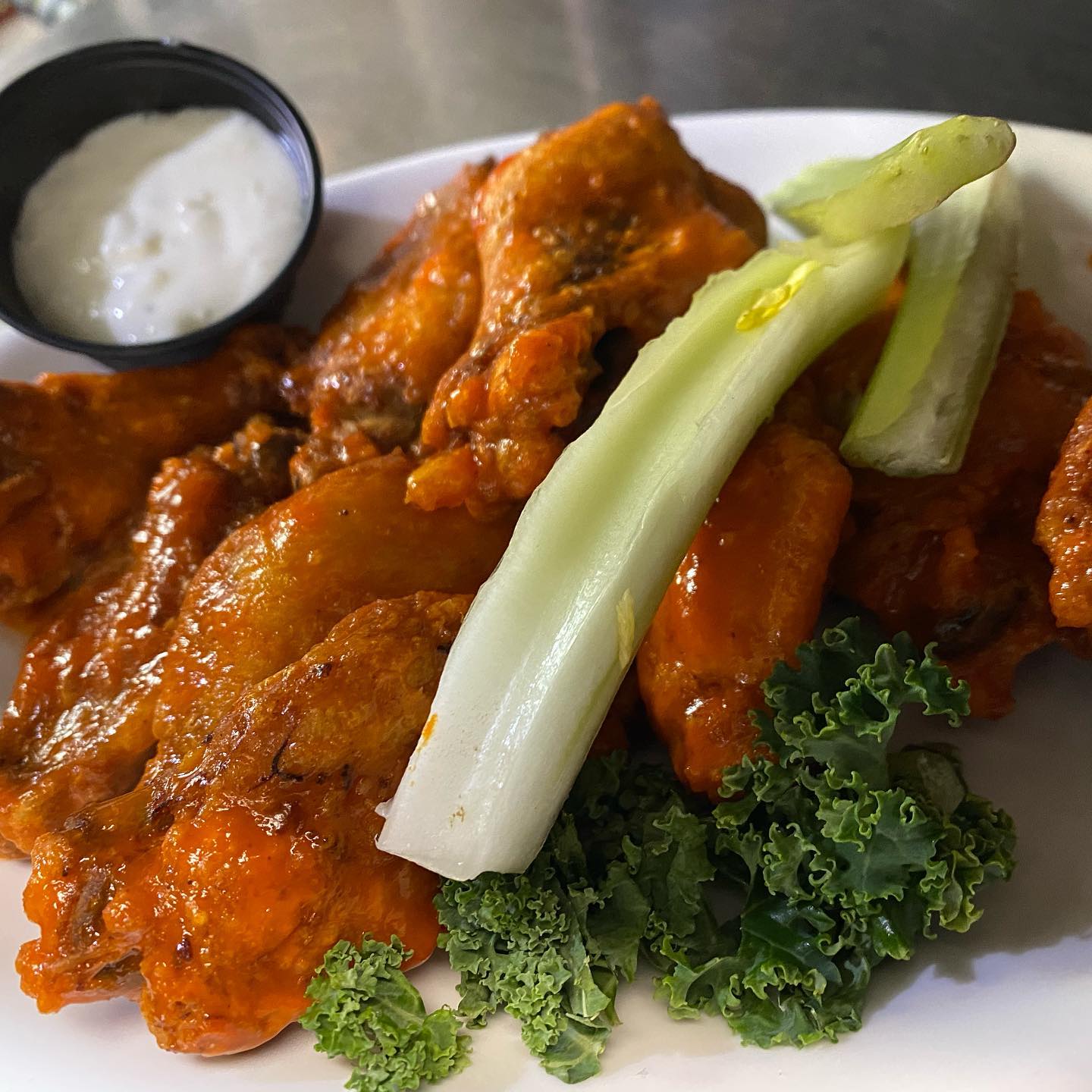 Buffalo chicken wings with celery and blue cheese dressing