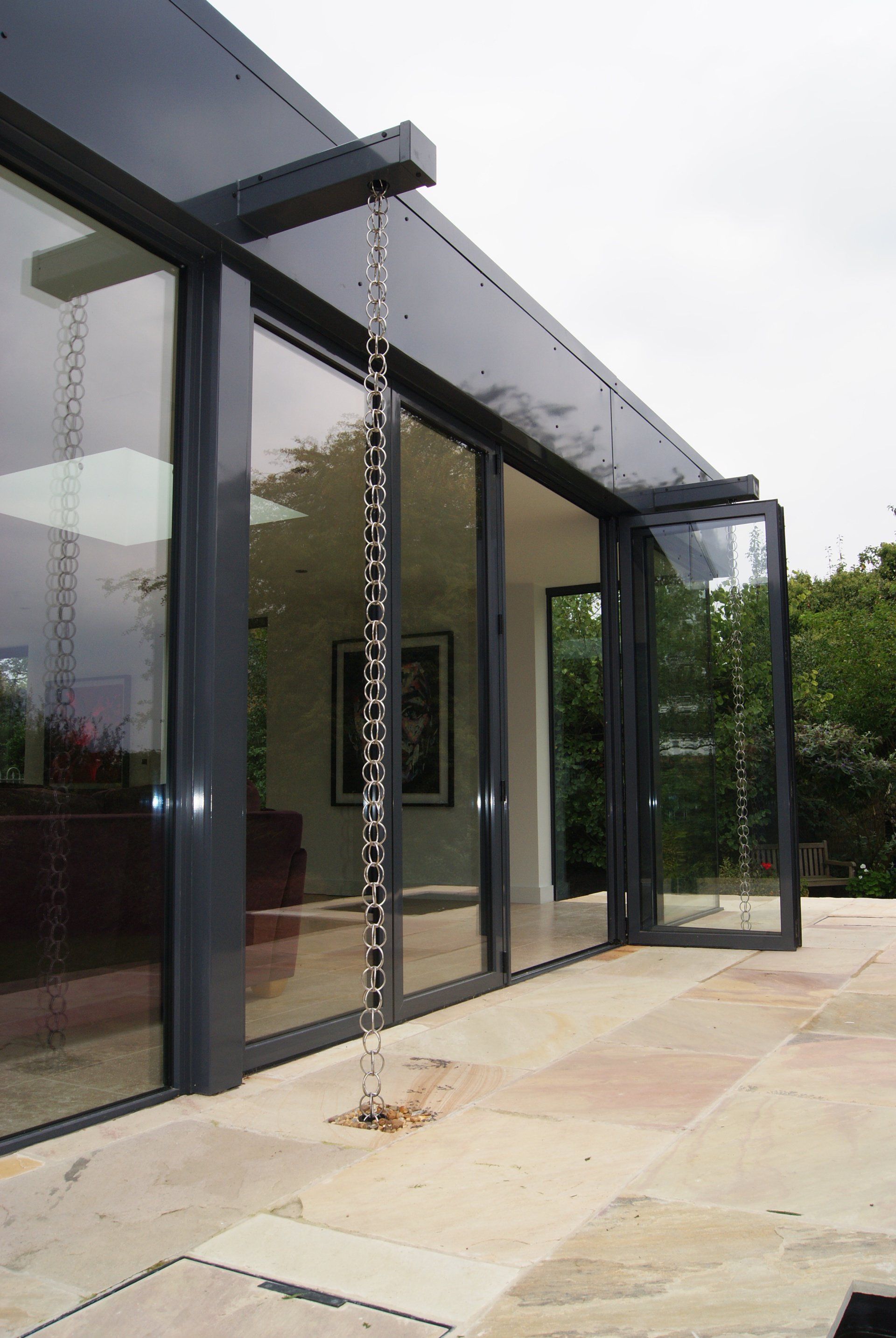 A chain is hanging from the side of a building
