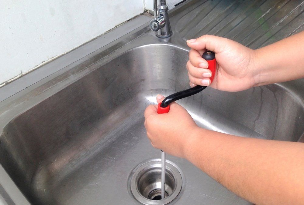 Cleaning Clog Pipe — Midland, TX — Randy's Rooter & Plumbing LLC Cleaning Clog Pipe — Midland, TX — Randy's Rooter & Plumbing LLC