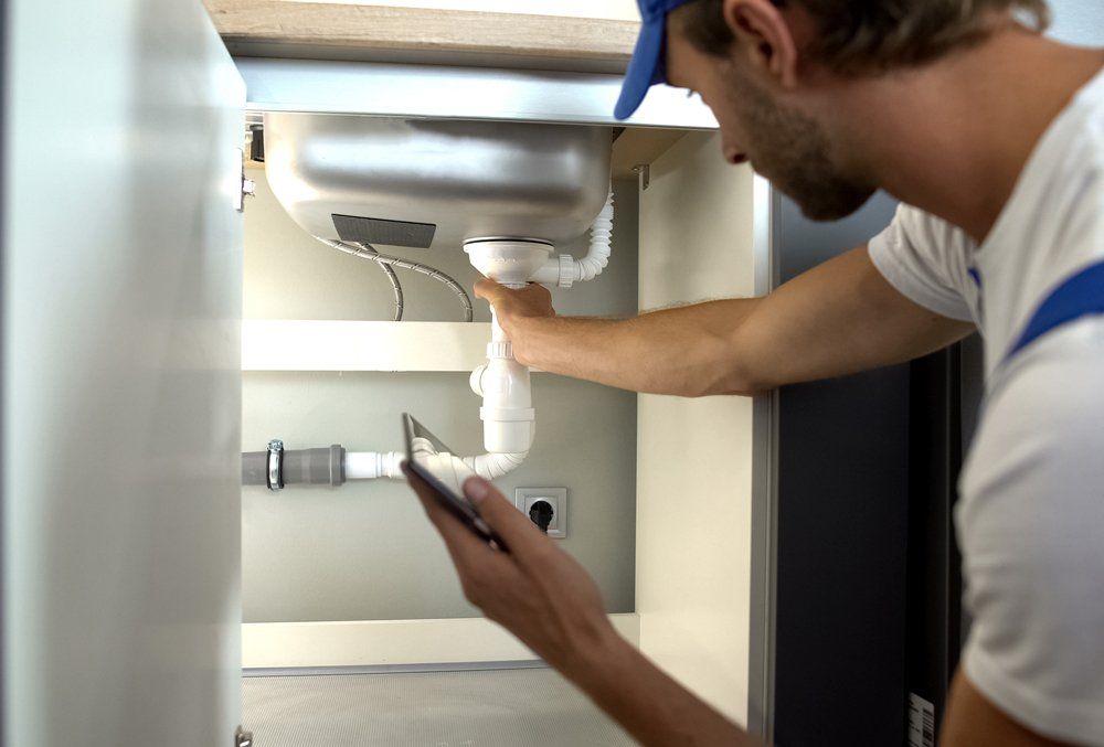 Inspecting Sink Pipes — Midland, TX — Randy's Rooter & Plumbing LLC Inspecting Sink Pipes — Midland, TX — Randy's Rooter & Plumbing LLC