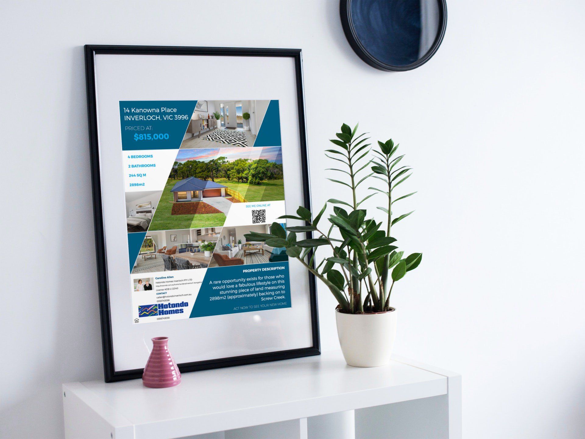Framed travel poster and potted plant on a white shelf in a bright room