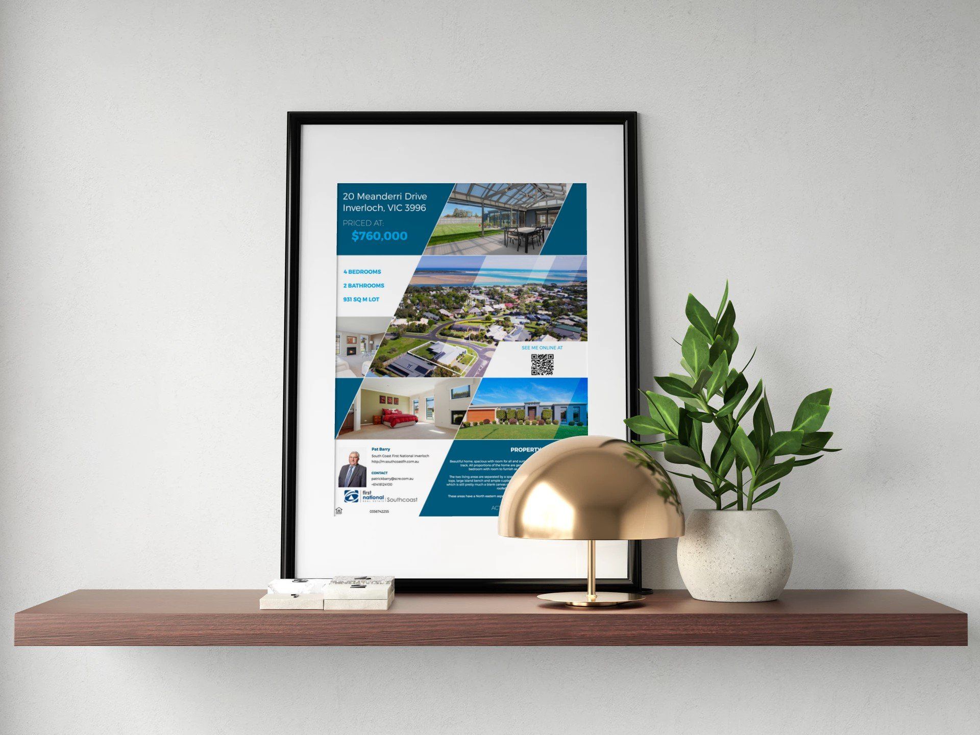 Framed coastal collage above a wooden shelf with gold lamp and potted plant