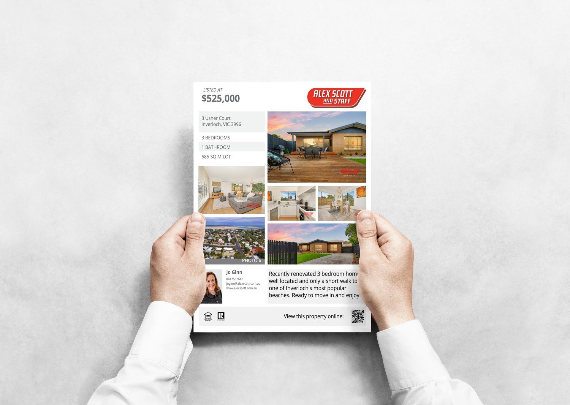 Hands holding a travel brochure with photos of landscapes, buildings, and a red header on a white background