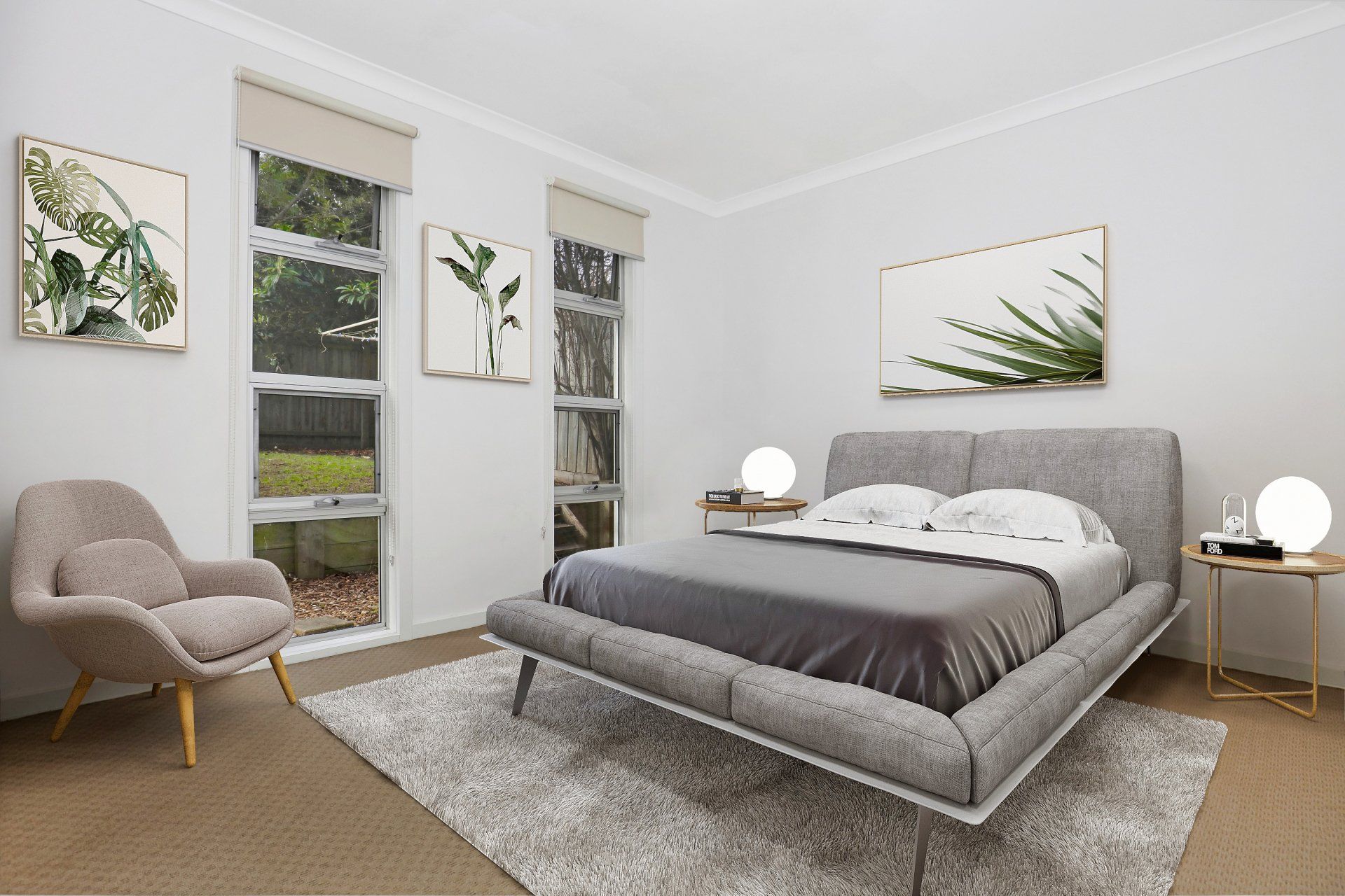 Modern gray bedroom with a bed, rug, chair, nightstands, and botanical wall art
