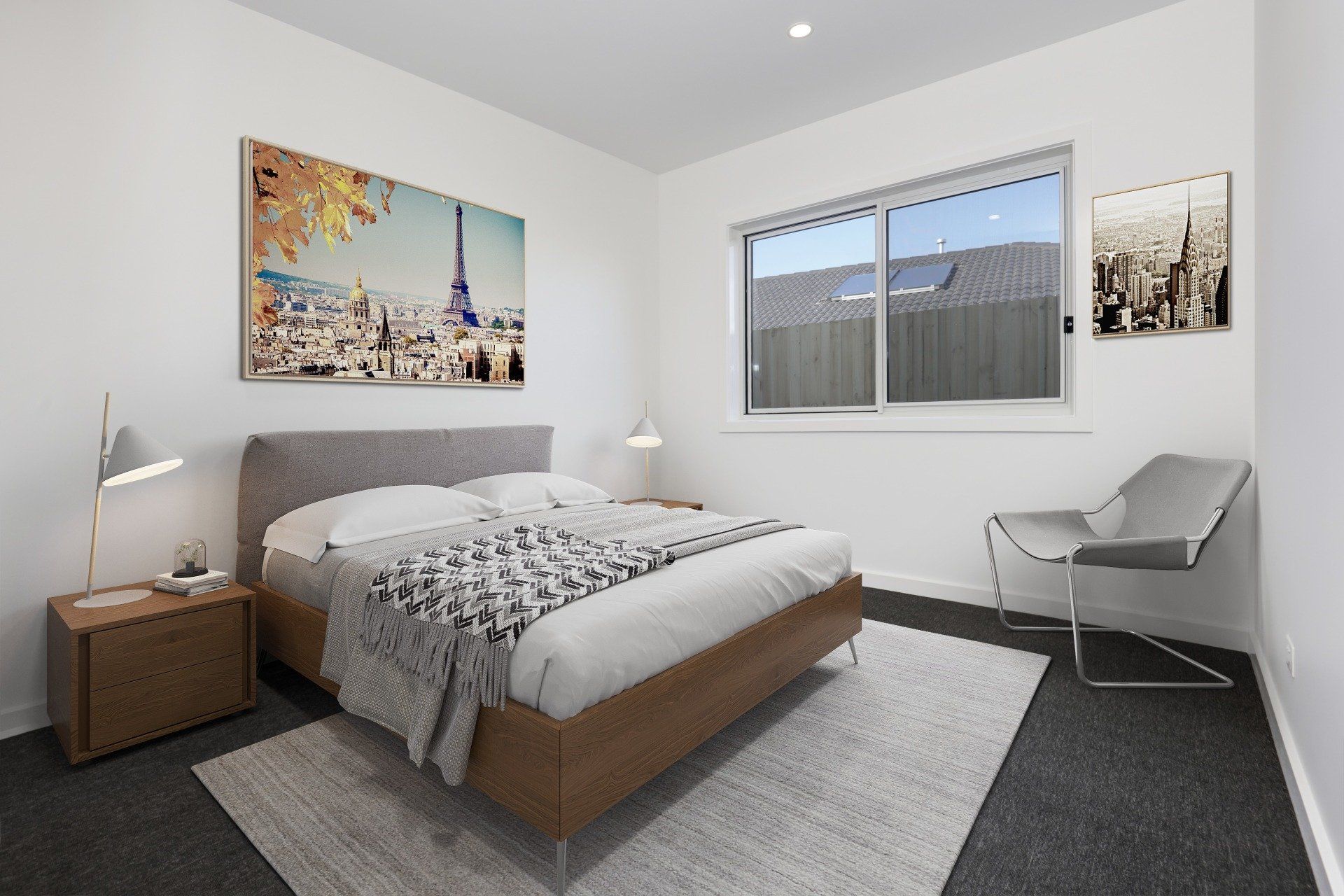 Minimal bedroom with bed, bedside table, chair, window, and wall art.