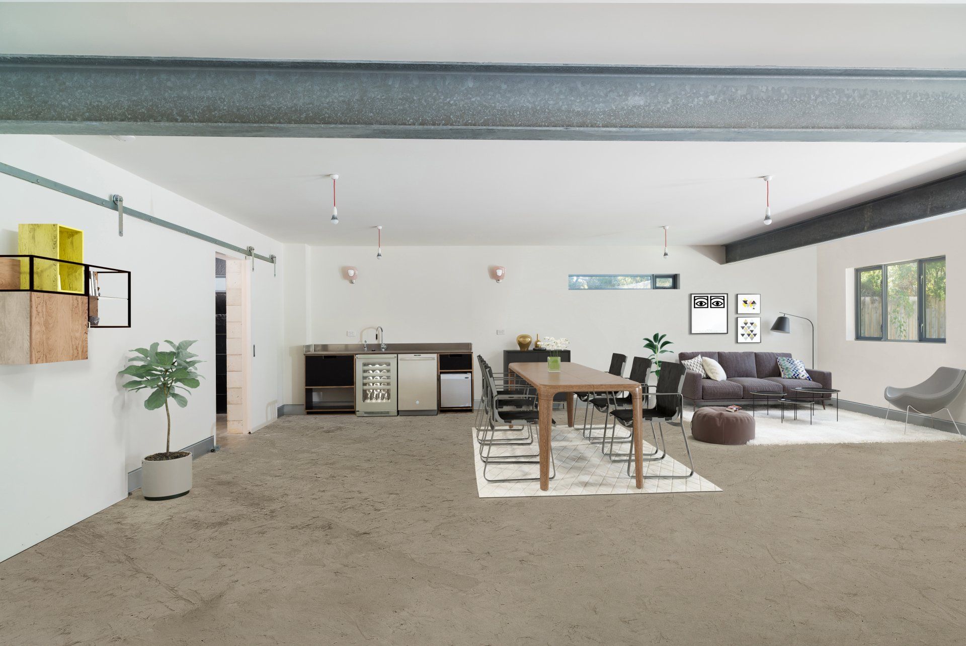 Modern open-plan living room with kitchen, dining table, gray sofa, and minimalist decor