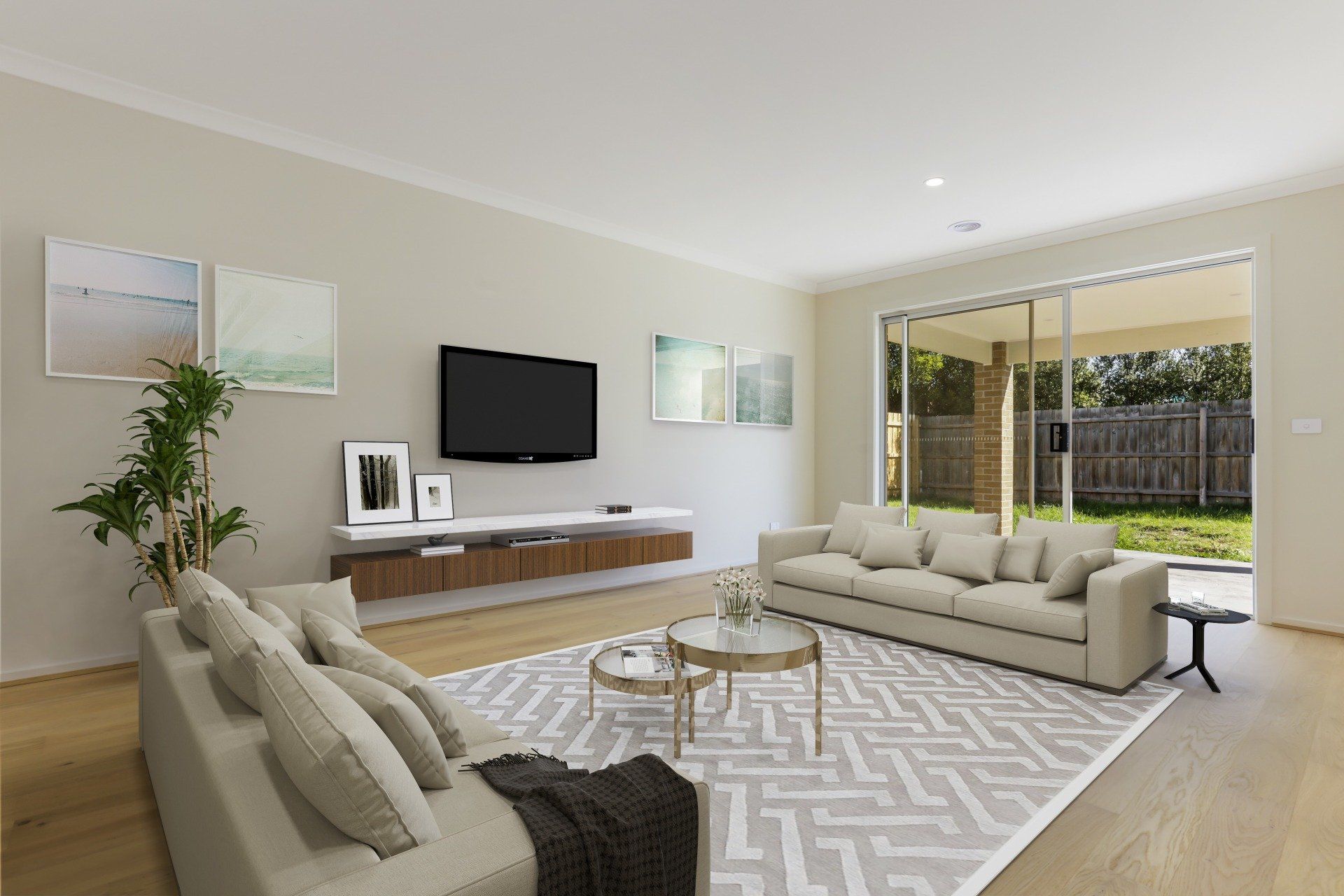 Modern living room with beige sofas, wall-mounted TV, coffee table, and open sliding doors to a patio.