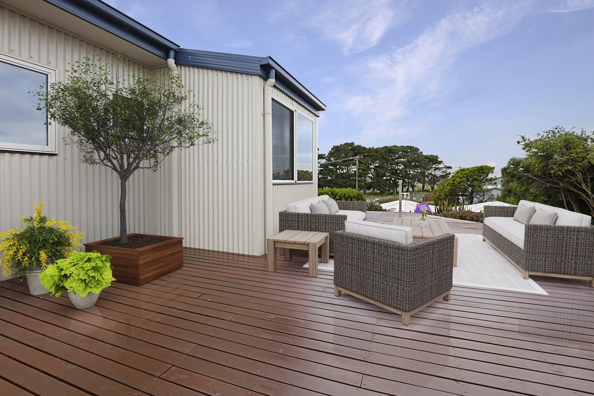 Modern rooftop deck with outdoor seating, wooden flooring, potted plants, and city views