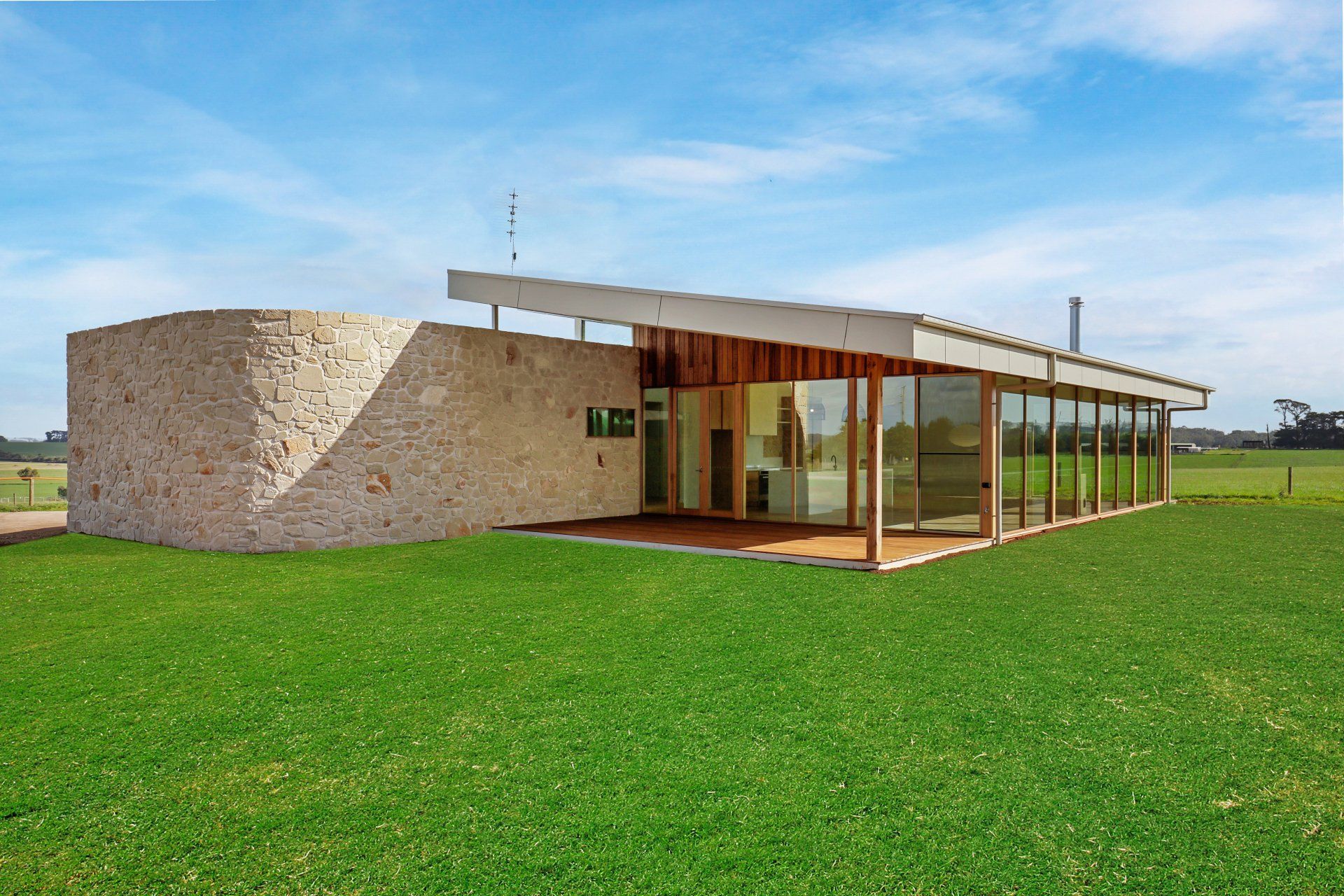 Curved stonework, extensive glazing, amazing outlook.