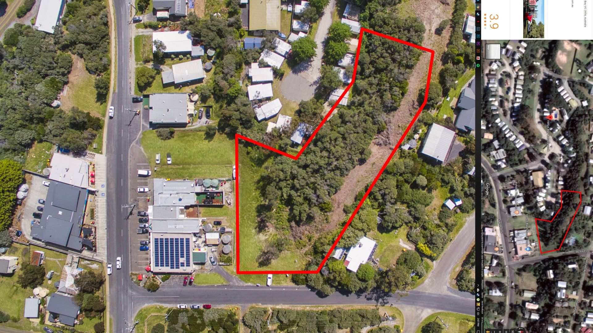 Aerial view of a tree-lined residential lot outlined in red beside houses and streets.