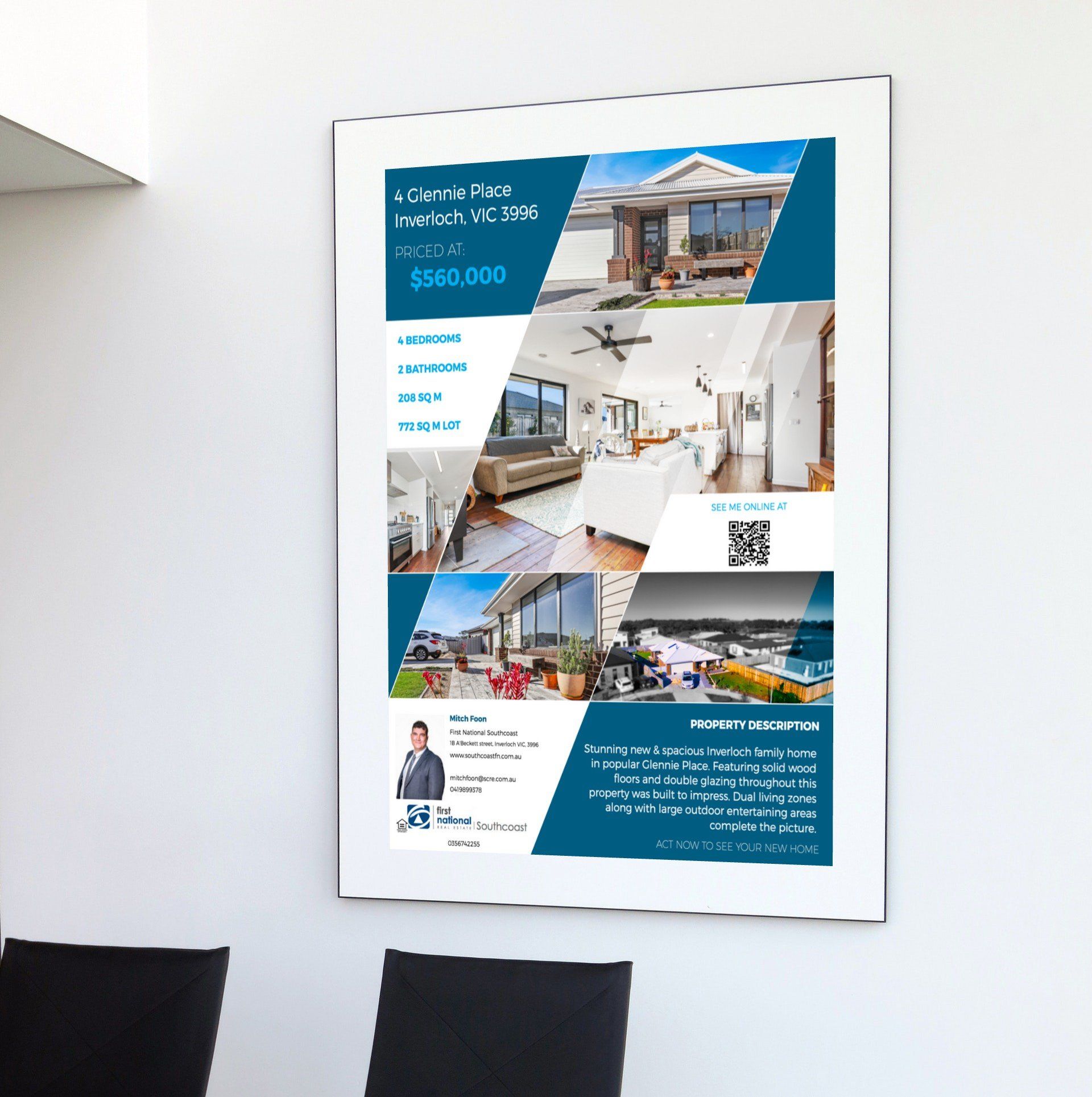 Real estate poster with house photos, blue geometric design, and QR code on a white wall