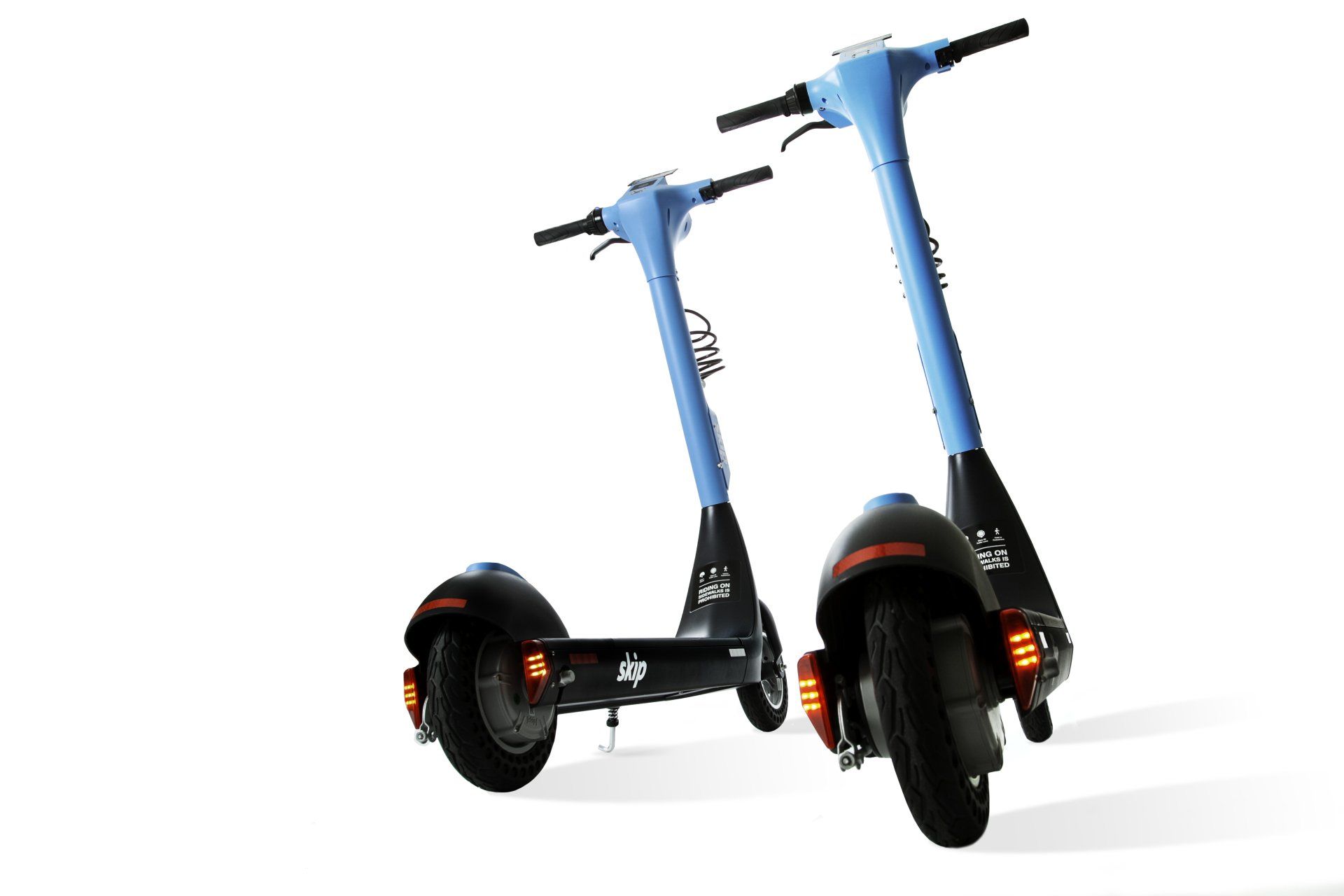 Two blue electric scooters on a white background, angled towards the viewer.