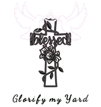 A cross with flowers and the words `` blessed '' on it.