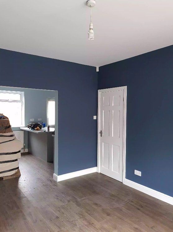 Navy painted room with white door and skirting in York