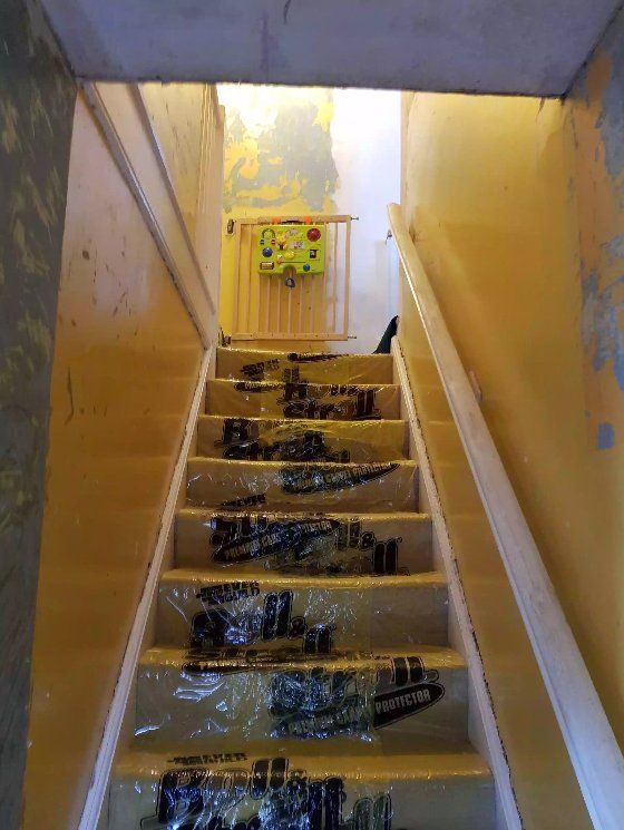 Staircase walls stripped and prepared with protected treads in York