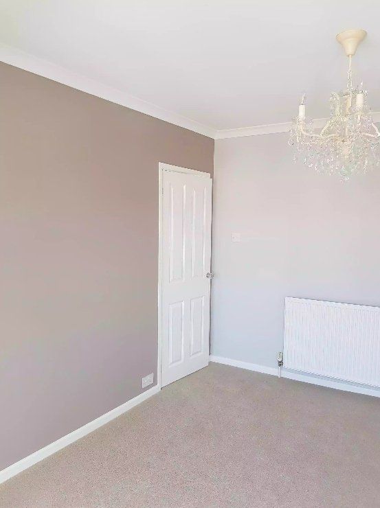Neutral grey painted bedroom with white ceiling and skirting in York
