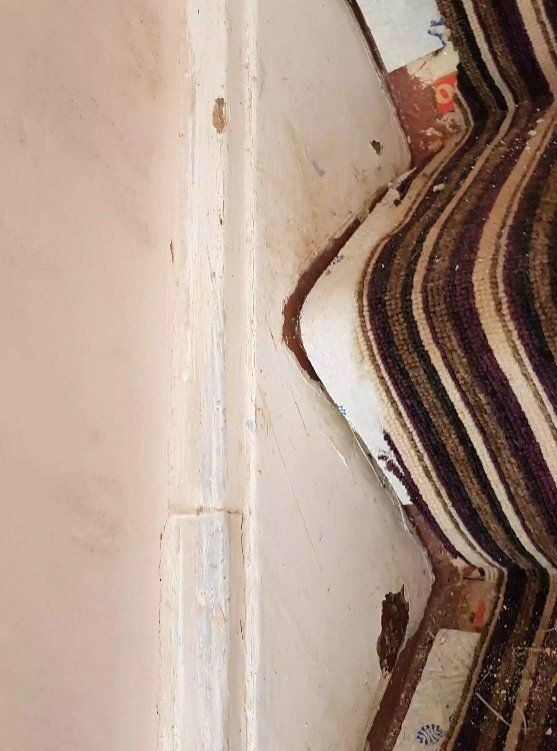 Chipped staircase woodwork prepared for repair in a York home
