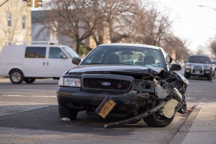 A car damaged after a severe collision and impact.