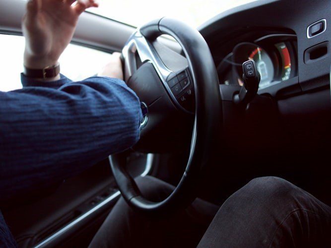 The image of a driver as they swerve on the road.