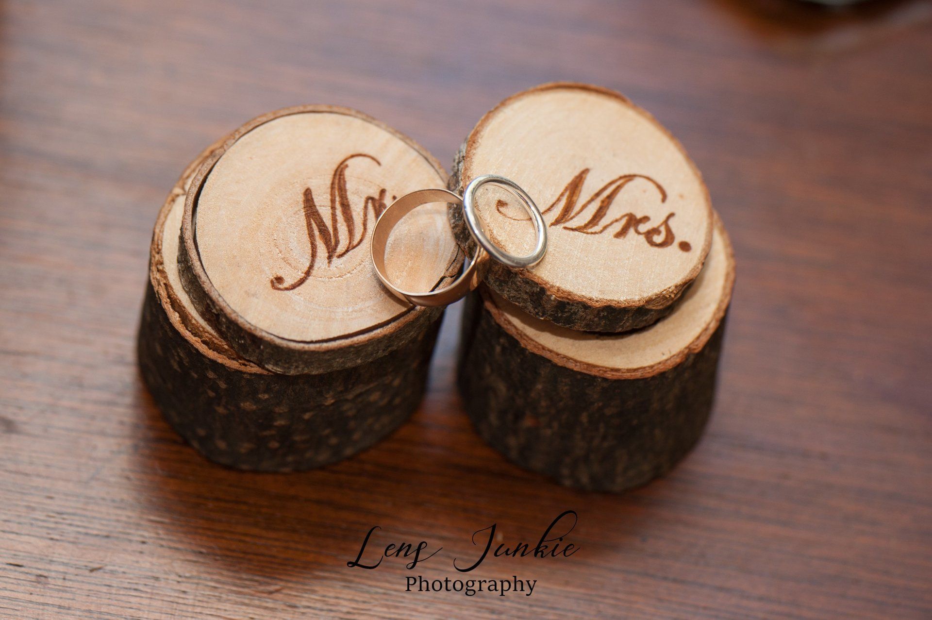 Wedding rings on wooden ring boxes etched with 