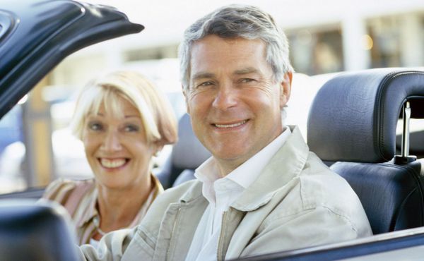 Happy couple in car