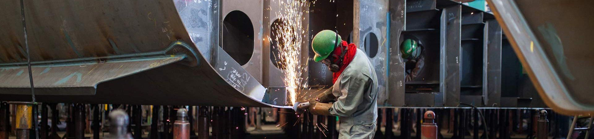 man working on boat build