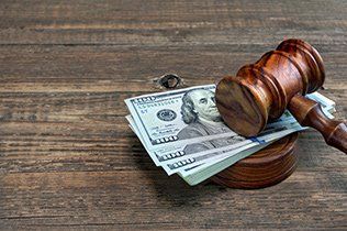 Gavel with Money ─ St. Joseph, Mi ─ Armstrong, Betker, & Schaeffer PLC