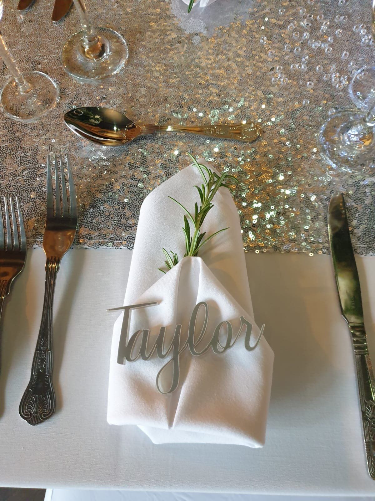 Laser cut acxrylic names for place settings at a wedding