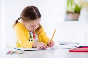 Little girl painting and writing - Child Care in Fall River, MA Little girl painting and writing - Child Care in Fall River, MA