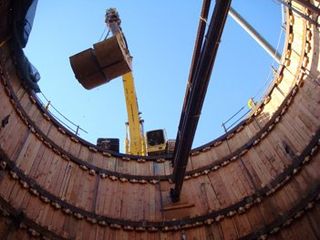 Loaded Buckets Being Hoisted — Las Vegas, NV — Hofsommer Excavating Inc. Loaded Buckets Being Hoisted — Las Vegas, NV — Hofsommer Excavating Inc.