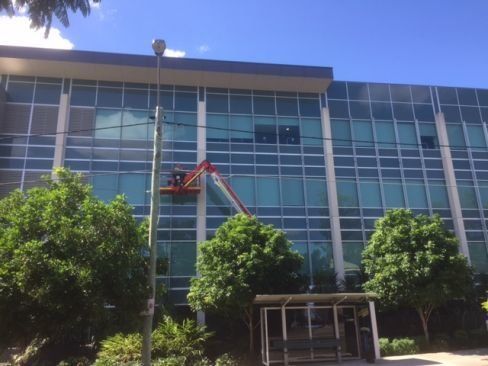 Man calling for commercial aluminium and glass services in Brisbane