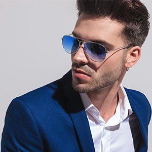 Stylish Sunglasses — Man in Sunglasses Looking Away to Side in Manasquan, NJ