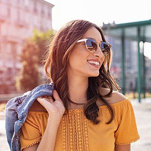 Eyeglasses — Young Woman Wearing Shades in Manasquan, NJ Eyeglasses — Young Woman Wearing Shades in Manasquan, NJ