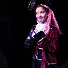 Young actor performing as Captain Hook in Peter Pan
