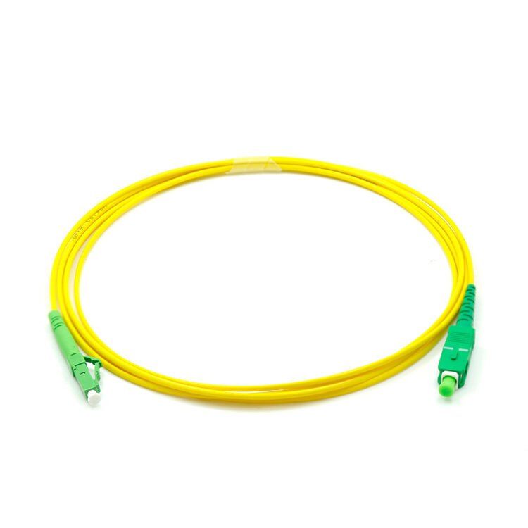 A yellow cable with a green end on a white background